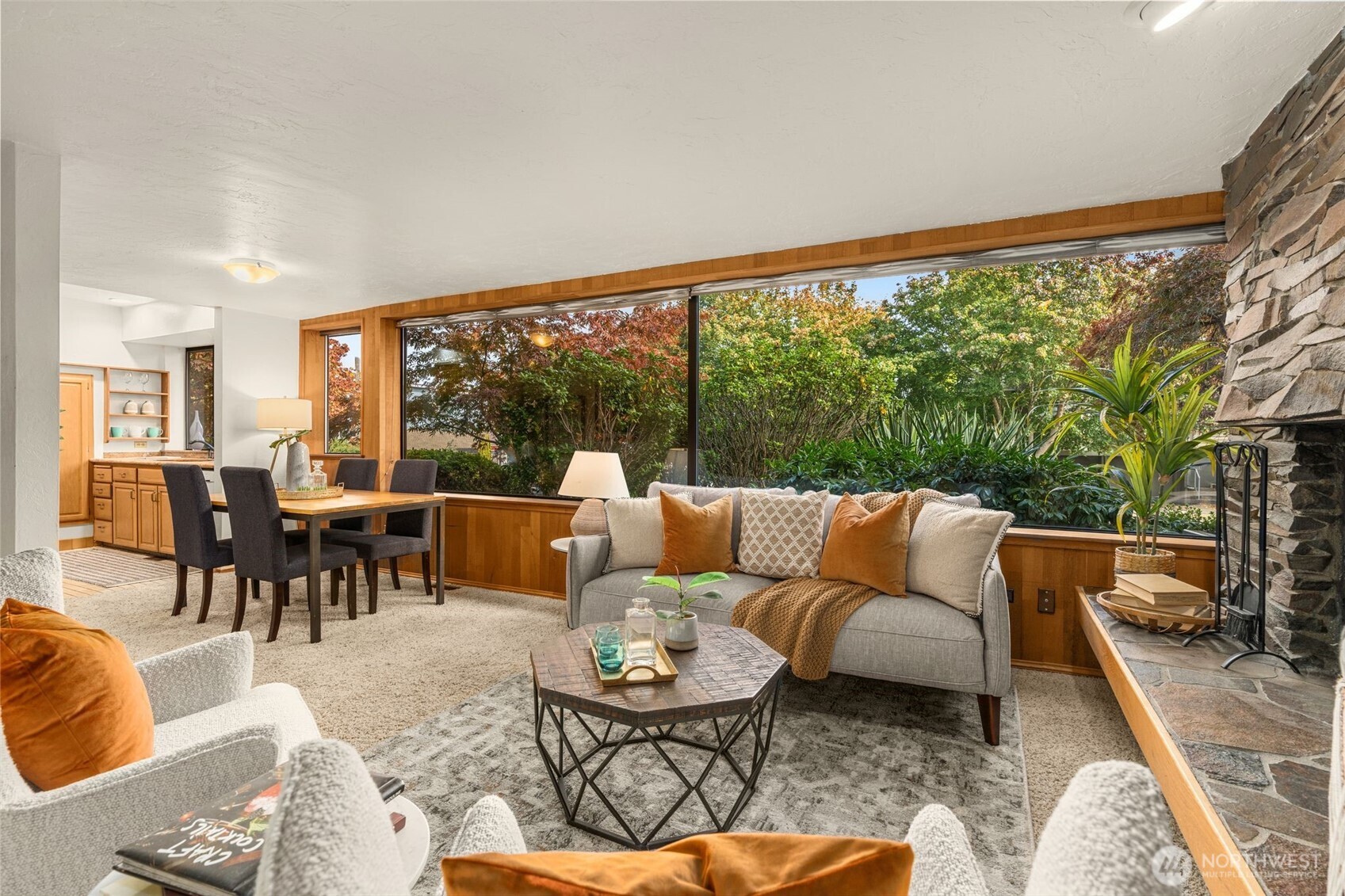 1627 California Avenue Southwest, Unit 1 Seattle, WA 98116 - Photo 5 of 24 a living room with furniture and a large window