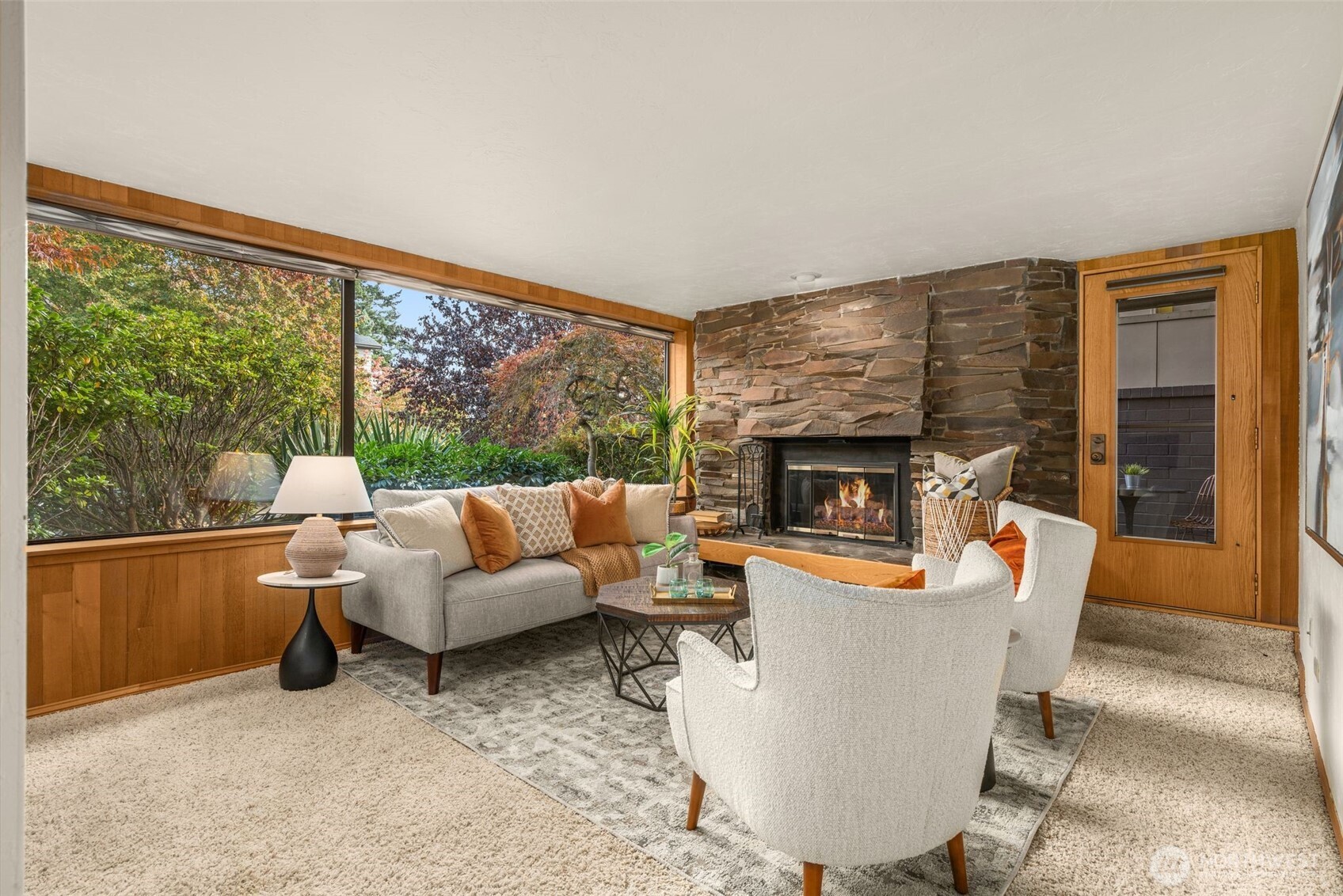 1627 California Avenue Southwest, Unit 1 Seattle, WA 98116 - Photo 6 of 24 a living room with furniture and a fireplace