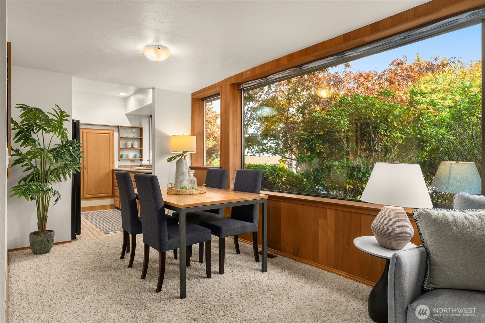 1627 California Avenue Southwest, Unit 1 Seattle, WA 98116 - Photo 8 of 24 a view of a dining room with furniture window and outside view