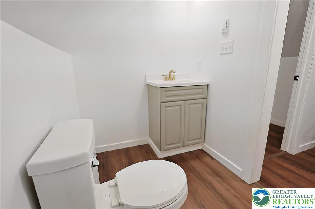 121 Ben Titus Road Tamaqua, PA 18252 - Photo 38 of 48 a bathroom with a toilet a sink a rug and a window