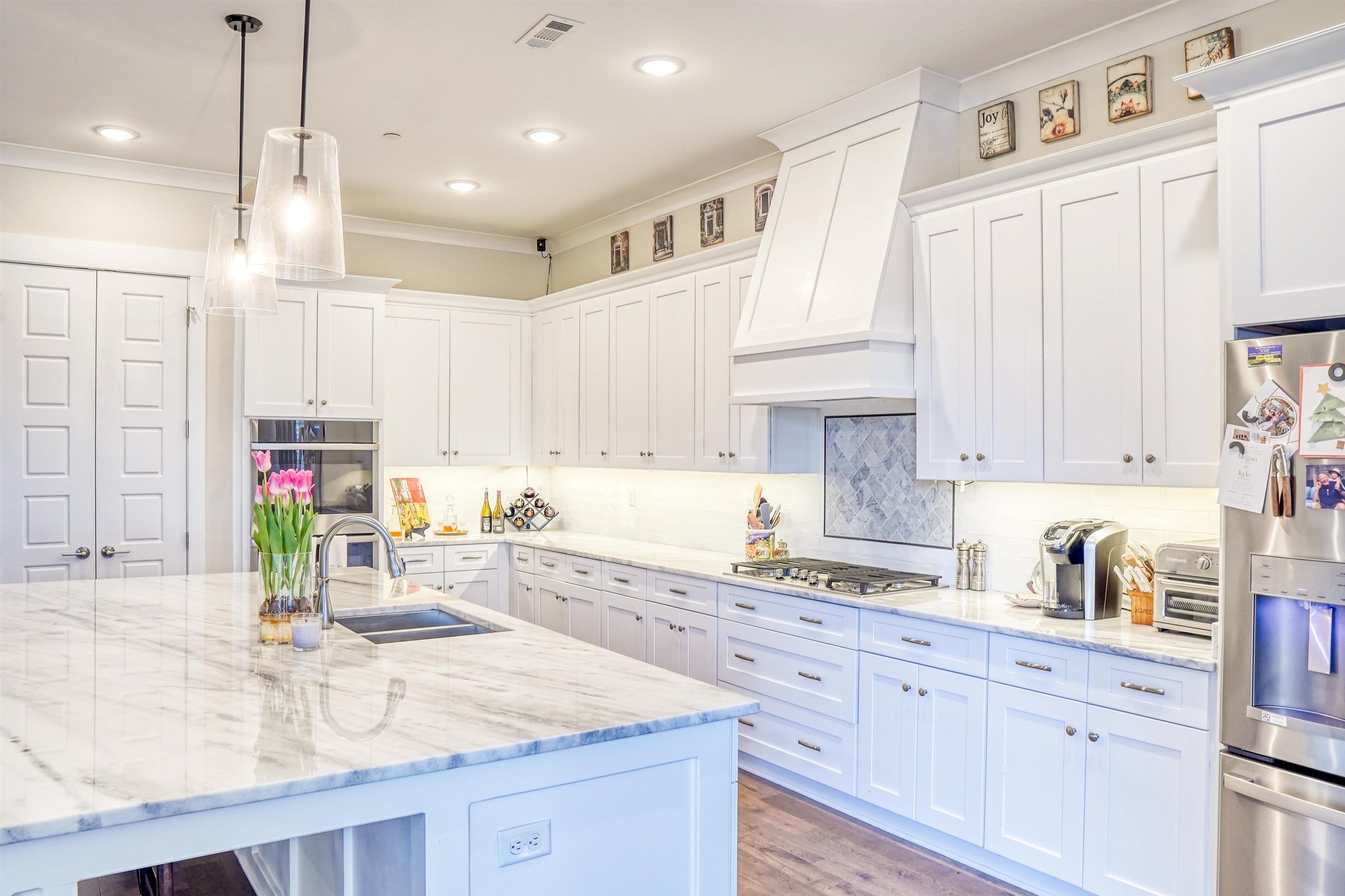 3538 Rokeby Farm Lane Collierville, TN 38017 - Photo 14 of 24 a kitchen with kitchen island granite countertop a sink a counter space appliances and cabinets