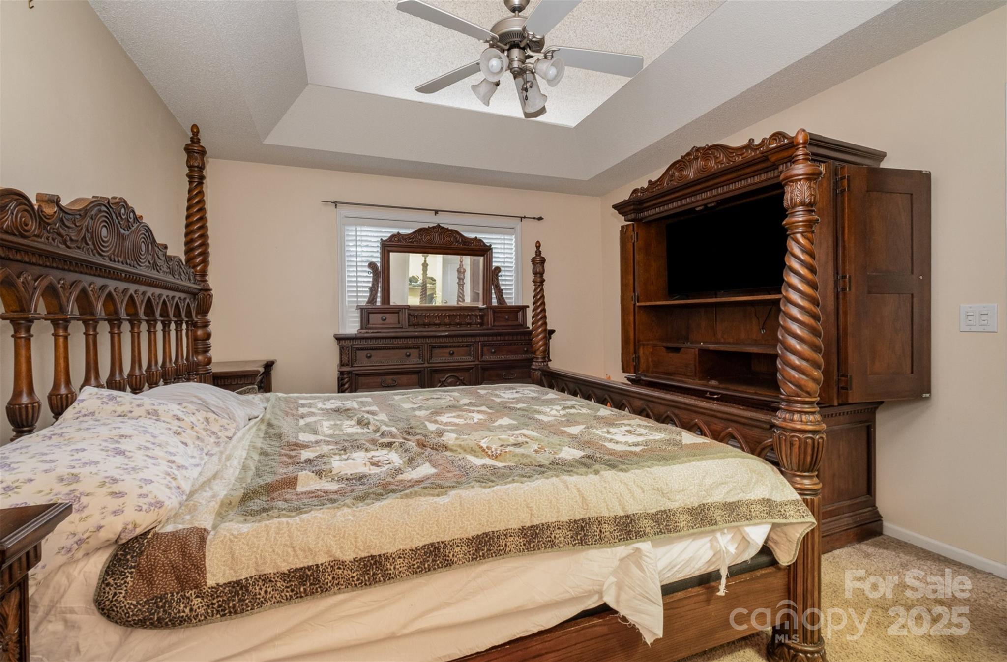 159 Pitts School Road Northwest Concord, NC 28027 - Photo 14 of 31 a bedroom with a bed and a television