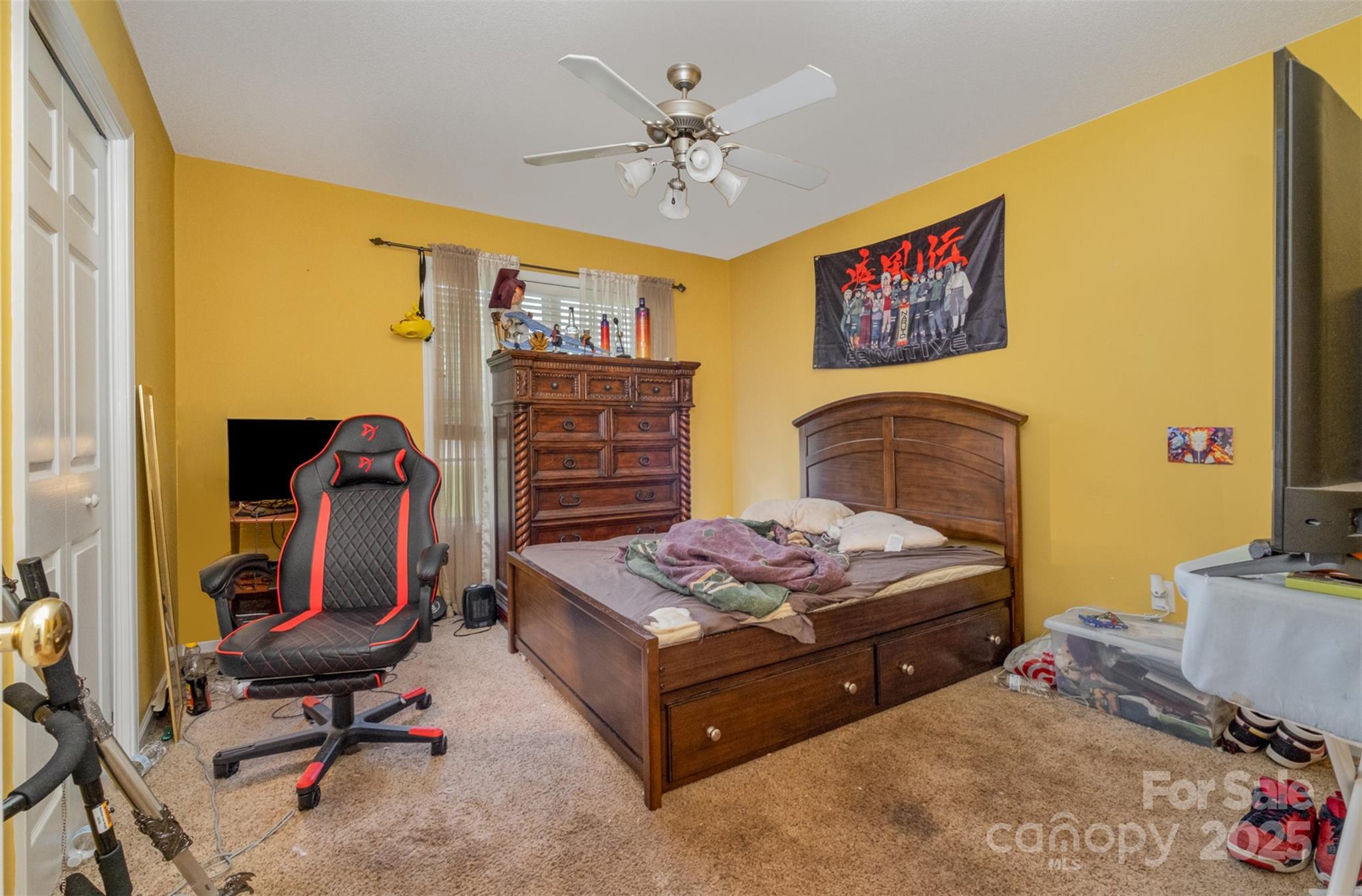 159 Pitts School Road Northwest Concord, NC 28027 - Photo 19 of 31 a bedroom with a bed and a chandelier