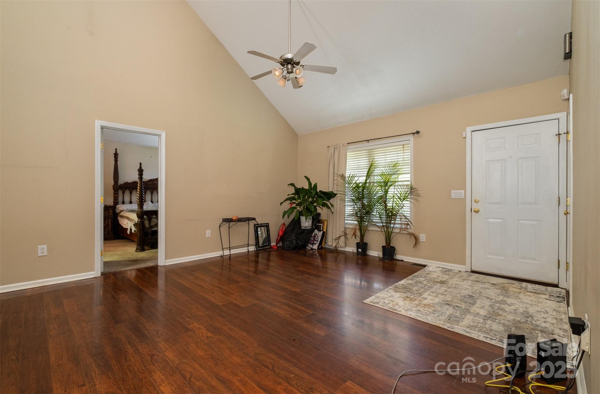 159 Pitts School Road Northwest Concord, NC 28027 - Photo 2 of 31 an empty room with wooden floor and a ceiling fan