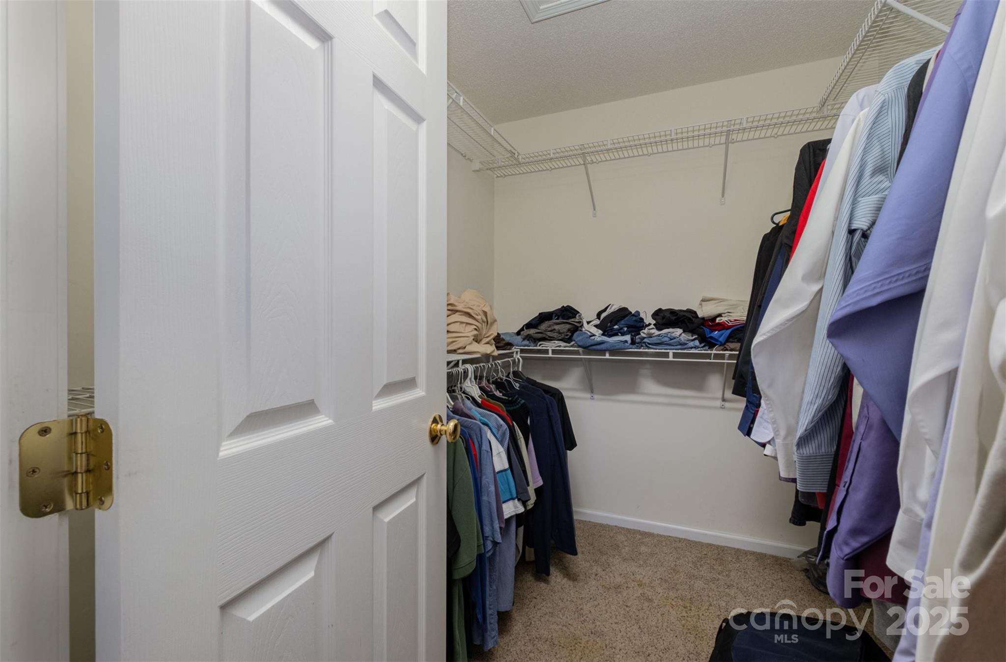 159 Pitts School Road Northwest Concord, NC 28027 - Photo 21 of 31 a view of walk in closet with clothes and shoes