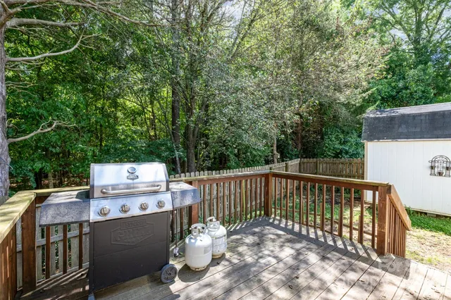 a view of a deck with a table and chairs