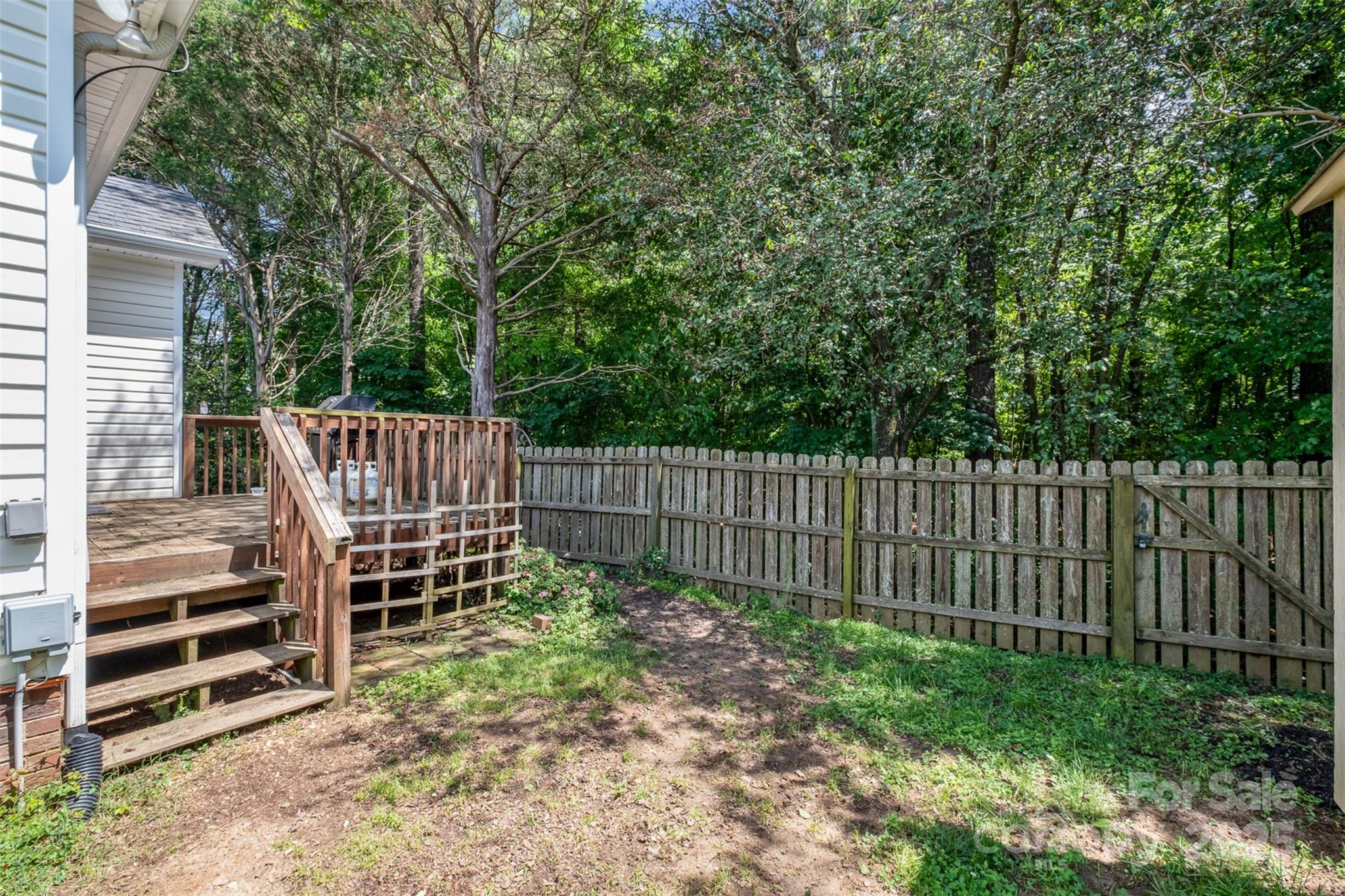 159 Pitts School Road Northwest Concord, NC 28027 - Photo 23 of 31 a view of a yard with wooden fence