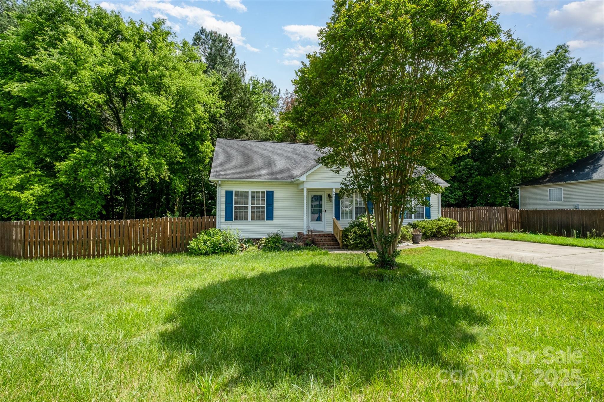 159 Pitts School Road Northwest Concord, NC 28027 - Photo 28 of 31 a view of a house with a yard and a tree