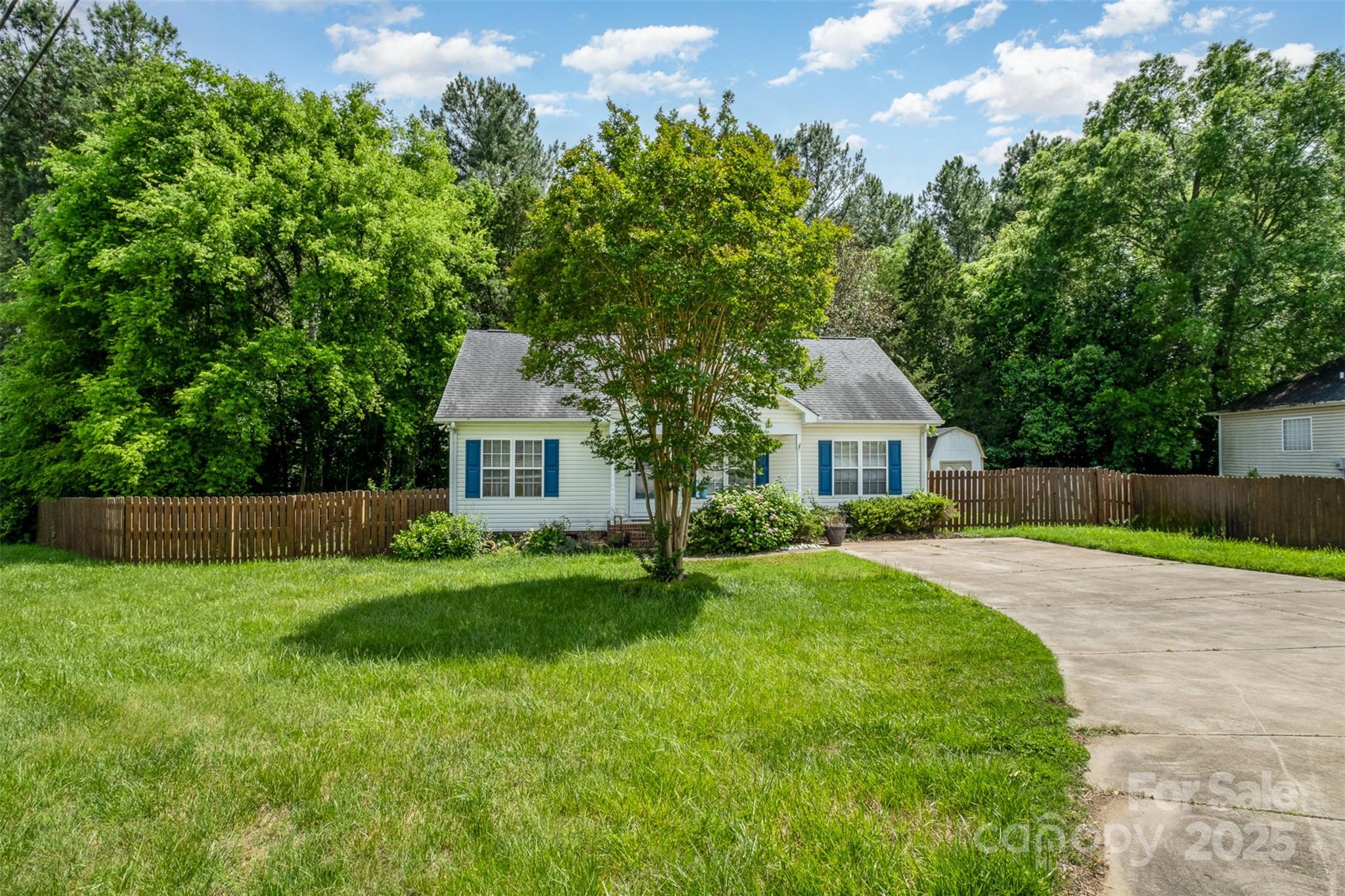 159 Pitts School Road Northwest Concord, NC 28027 - Photo 29 of 31 a front view of a house with a yard and trees
