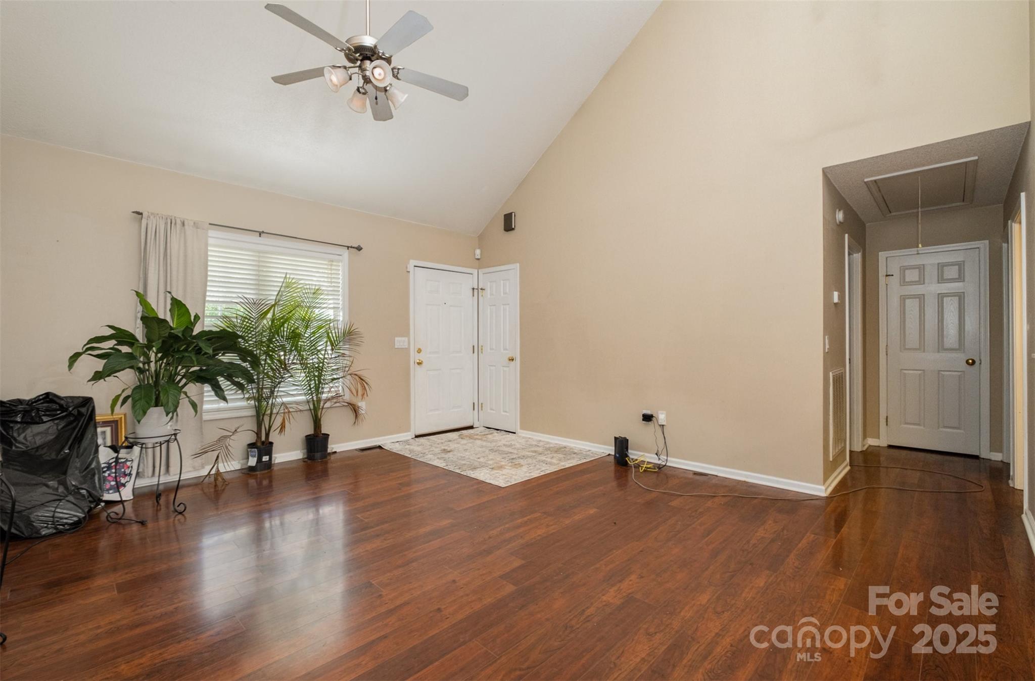 159 Pitts School Road Northwest Concord, NC 28027 - Photo 4 of 31 a view of empty room with wooden floor and potted plant