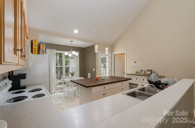 a living room with furniture a large window and gym equipment