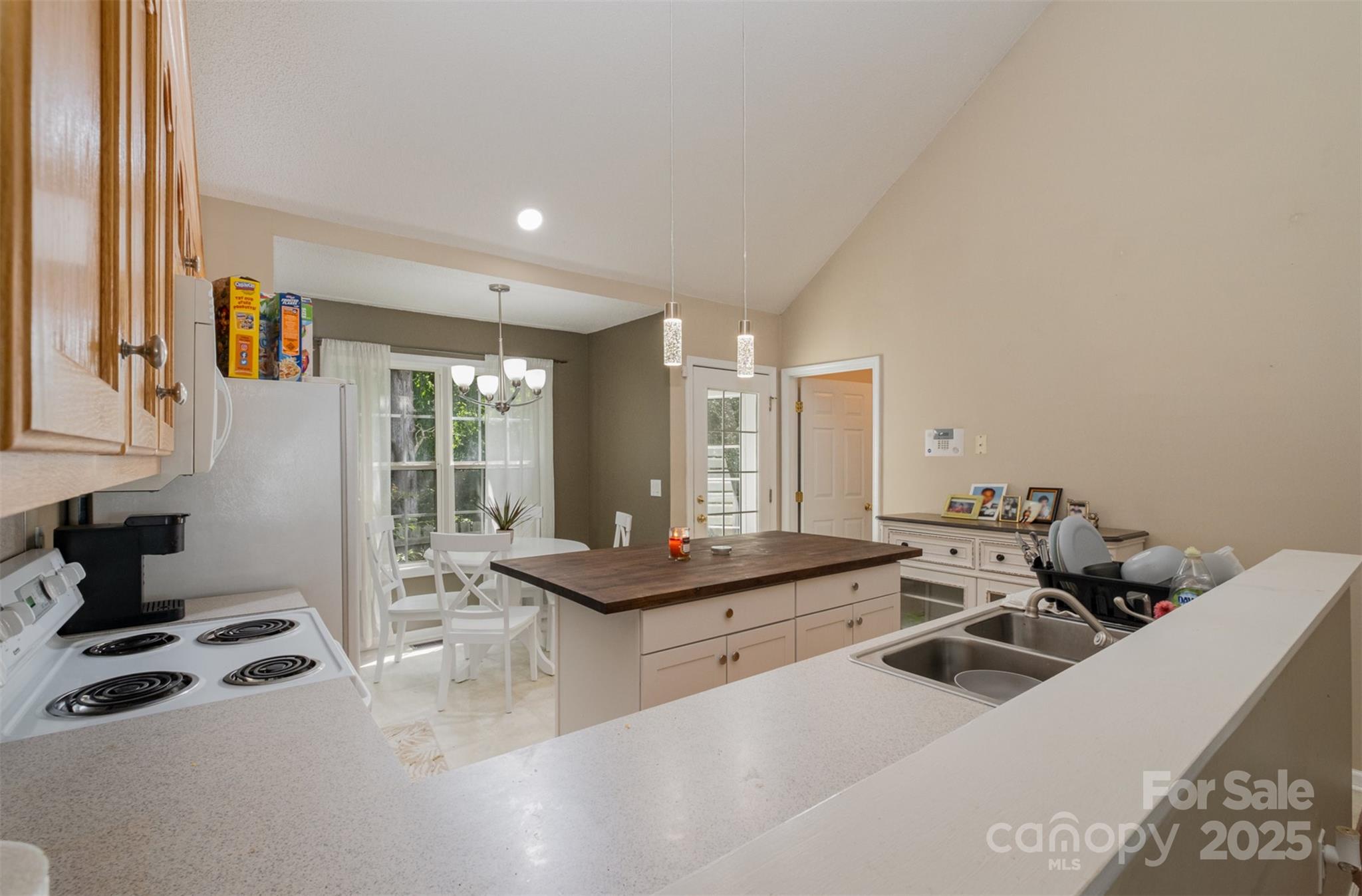159 Pitts School Road Northwest Concord, NC 28027 - Photo 8 of 31 a living room with furniture a large window and gym equipment
