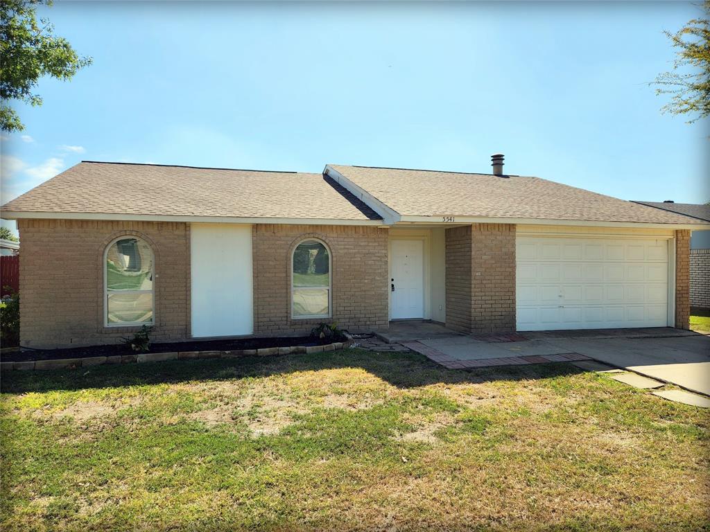 5541 Ragan Drive The Colony, TX 75056 - Photo 1 of 23 a front view of house with yard