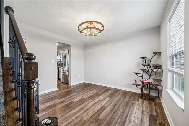 a view of entryway with wooden floor