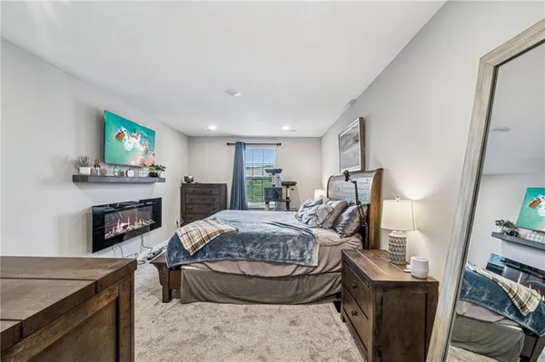 a bed room with furniture and a fireplace