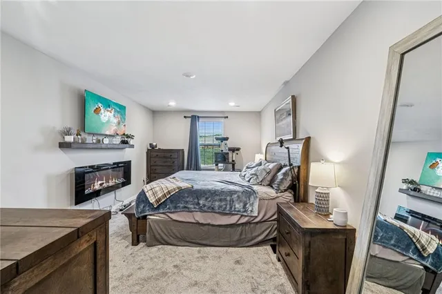 a spacious bedroom with a bed and furniture