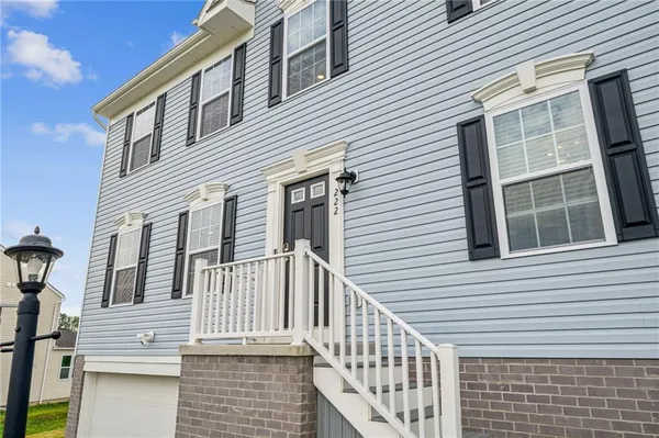 a view of a house with large windows