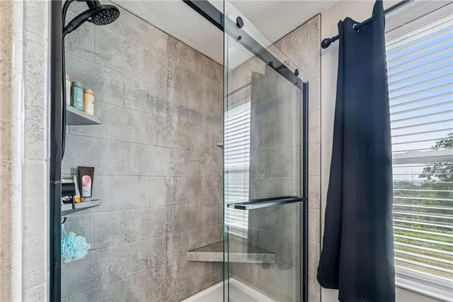 a view of a livingroom with furniture and gym equipment