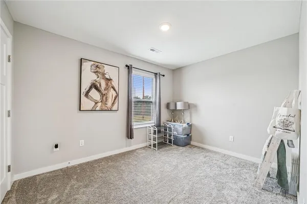 a view of room with window and workspace