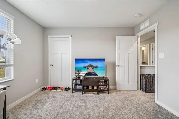 a room with furniture and gym equipment
