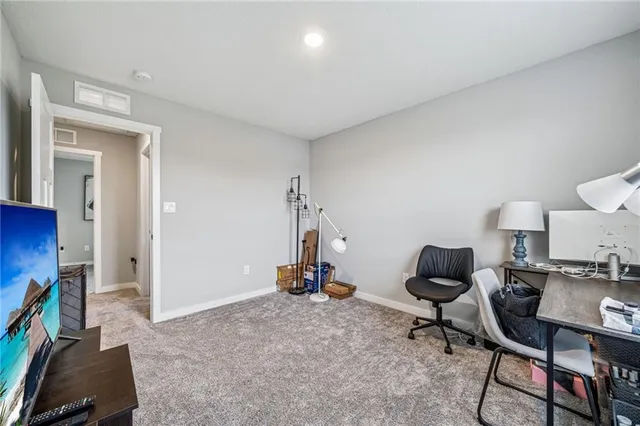 a room with furniture and gym equipment