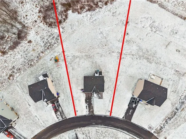 a view of a fireplace with furniture and wooden floor