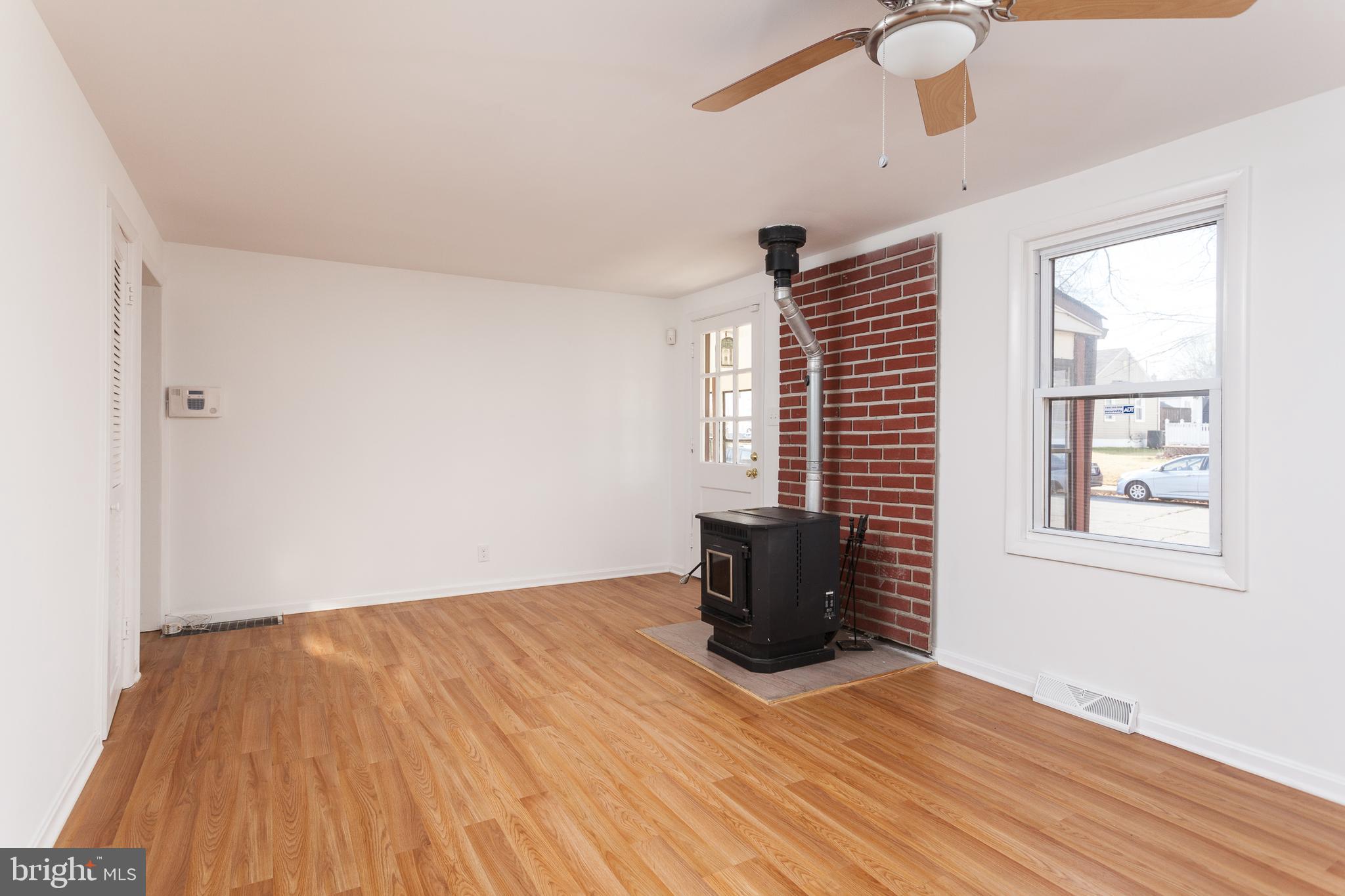 3 Branch Street Baltimore, MD 21221 - Photo 2 of 28 Living Room with Pellet Stove