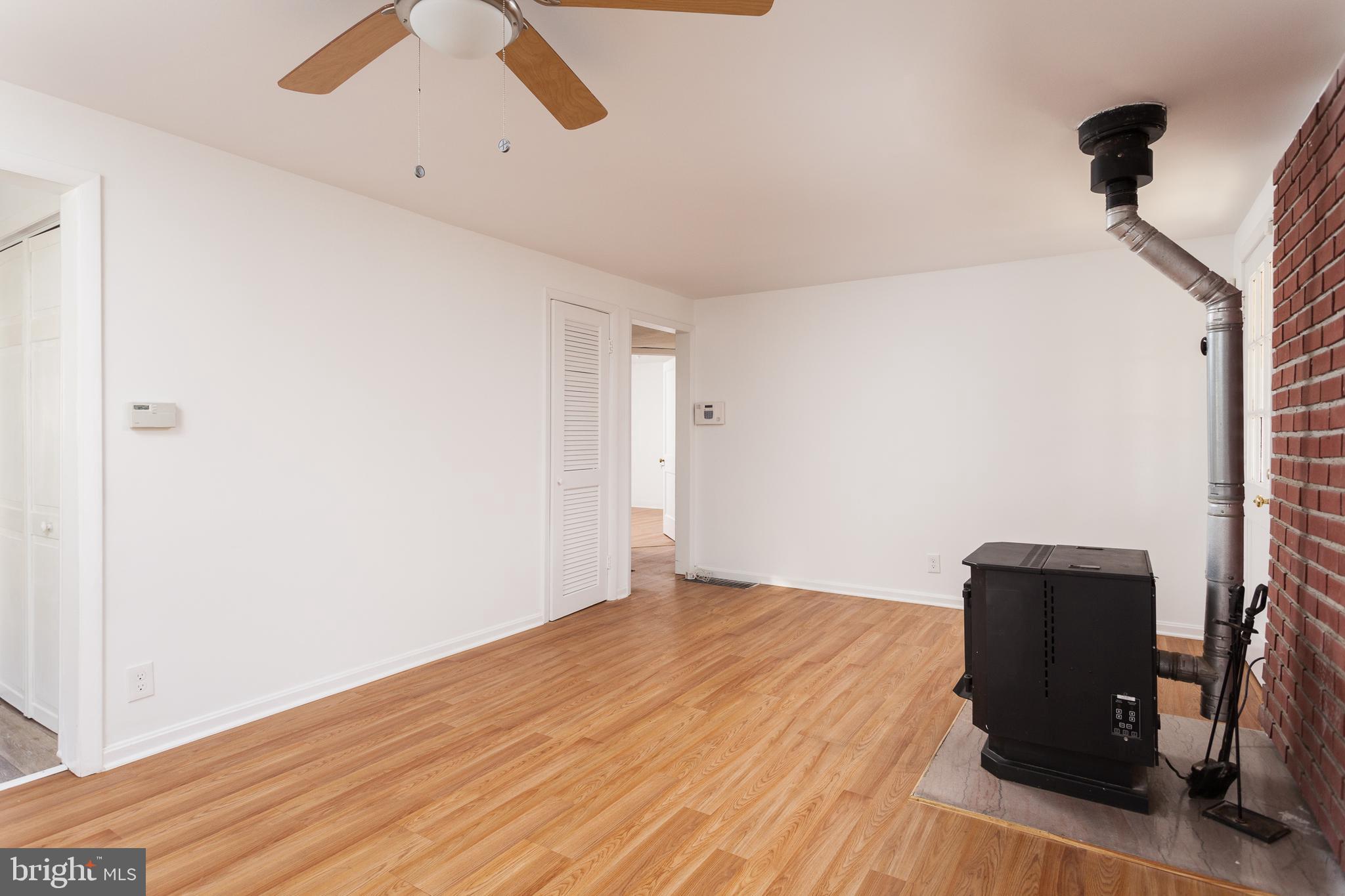3 Branch Street Baltimore, MD 21221 - Photo 3 of 28 Living Room with Pellet Stove