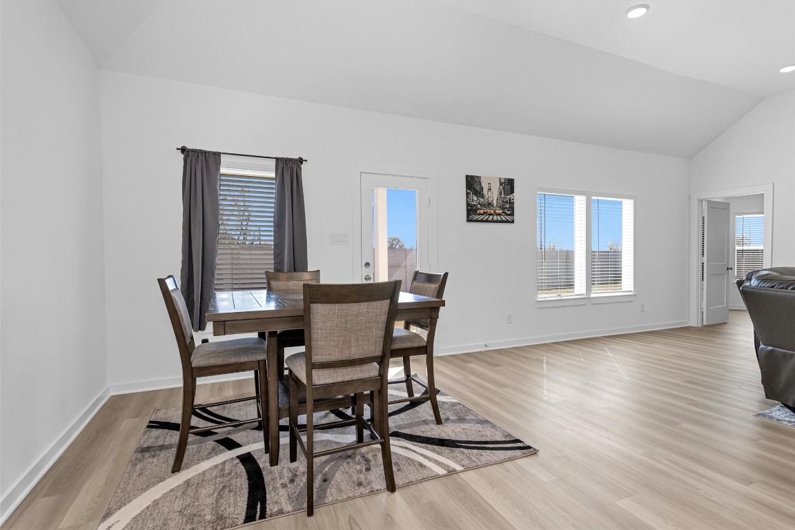 2127 Heather Rdg Way Rosenberg, TX 77471 - Photo 15 of 41 a view of a dining room with furniture and wooden floor