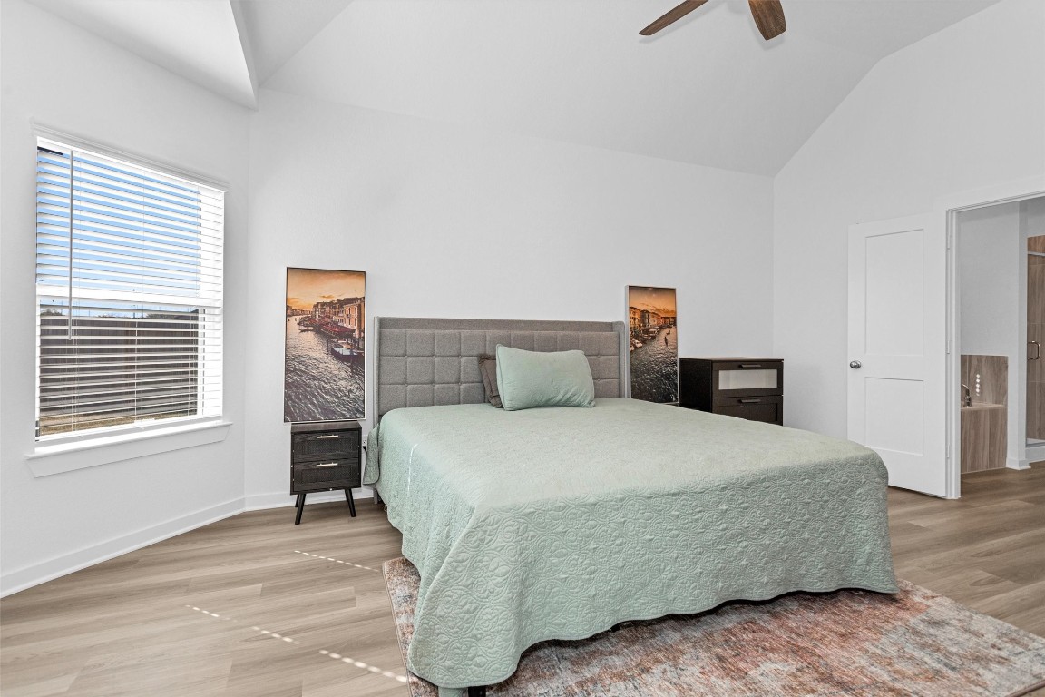 2127 Heather Rdg Way Rosenberg, TX 77471 - Photo 19 of 41 a bedroom with a bed a window and dresser