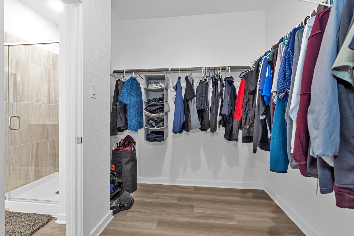 2127 Heather Rdg Way Rosenberg, TX 77471 - Photo 25 of 41 a view of walk in closet with clothes