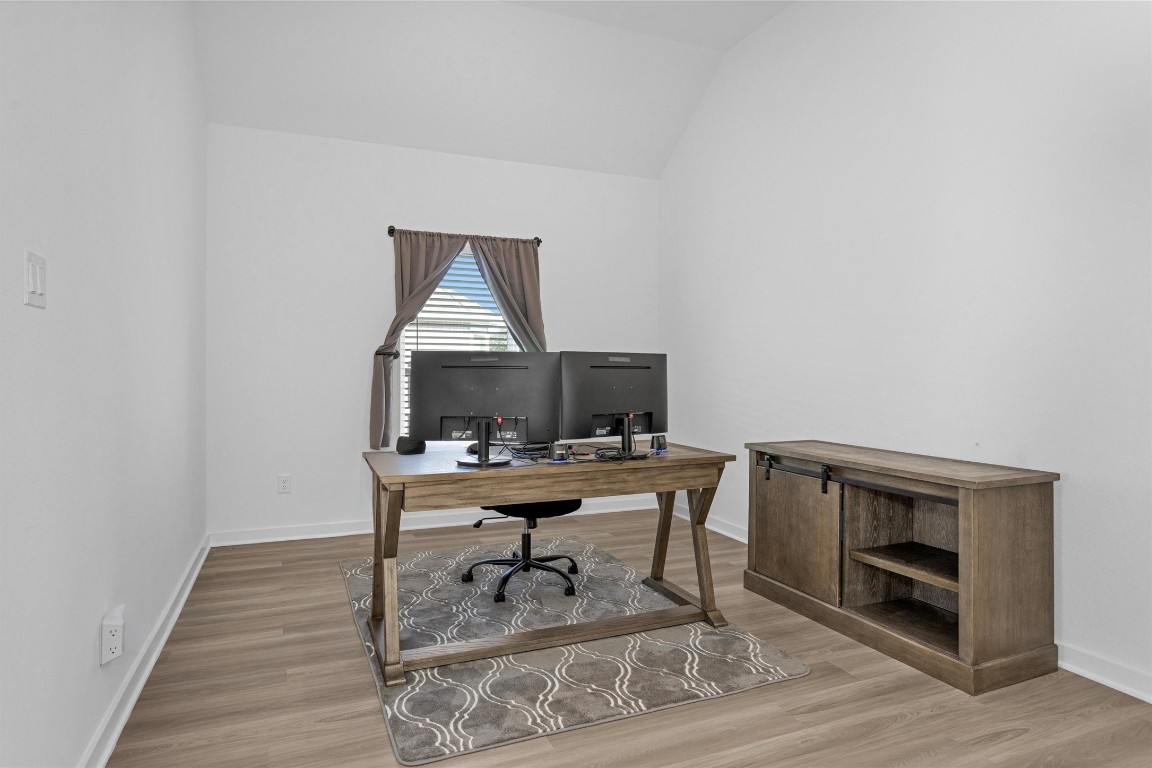 2127 Heather Rdg Way Rosenberg, TX 77471 - Photo 9 of 41 a workspace with furniture and wooden floor