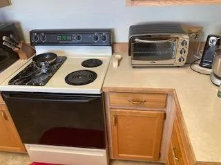 a view of balcony with wooden floor and seating space