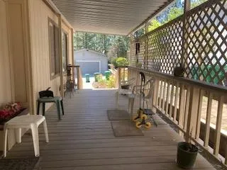 a front view of a house with lots of flowers