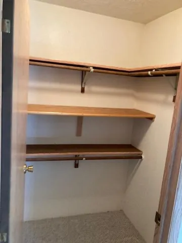 view of a room with rack on the wall