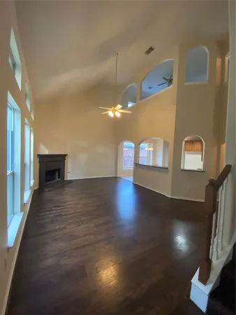 a view of an entryway with wooden floor and a window