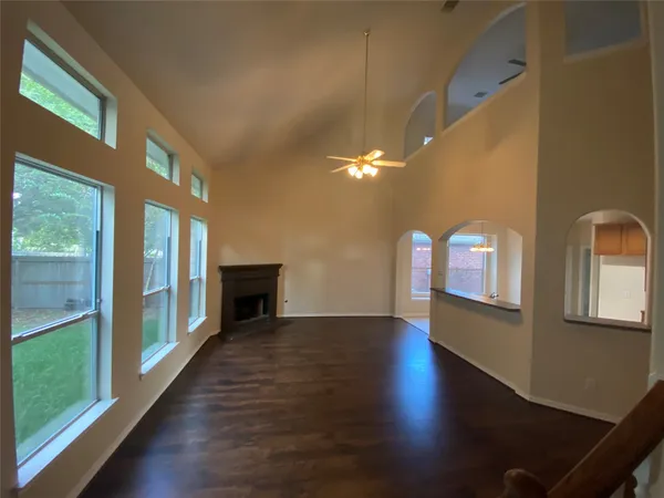 a view of an entryway with wooden floor