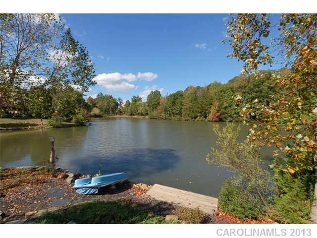 924 Ashford Way Fort Mill, SC 29708 - Photo 14 of 16 a view of a lake with houses in the back