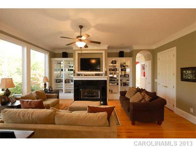 924 Ashford Way Fort Mill, SC 29708 - Photo 5 of 16 a living room with furniture a fireplace and a flat screen tv