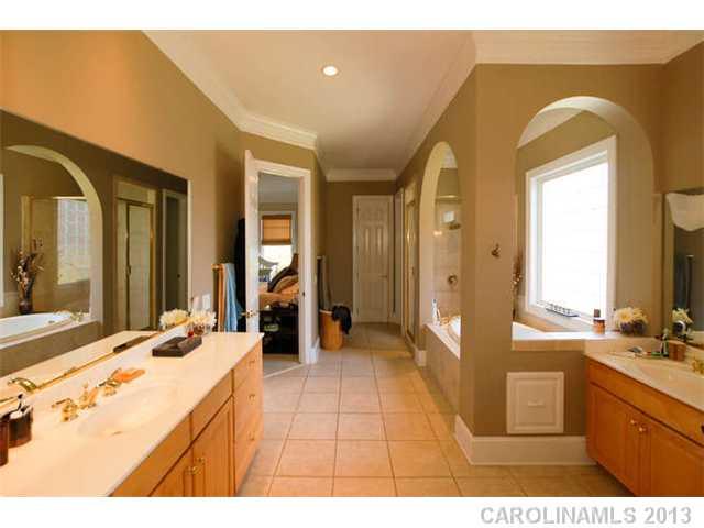 924 Ashford Way Fort Mill, SC 29708 - Photo 9 of 16 a bathroom with a sink mirror and a bath tub