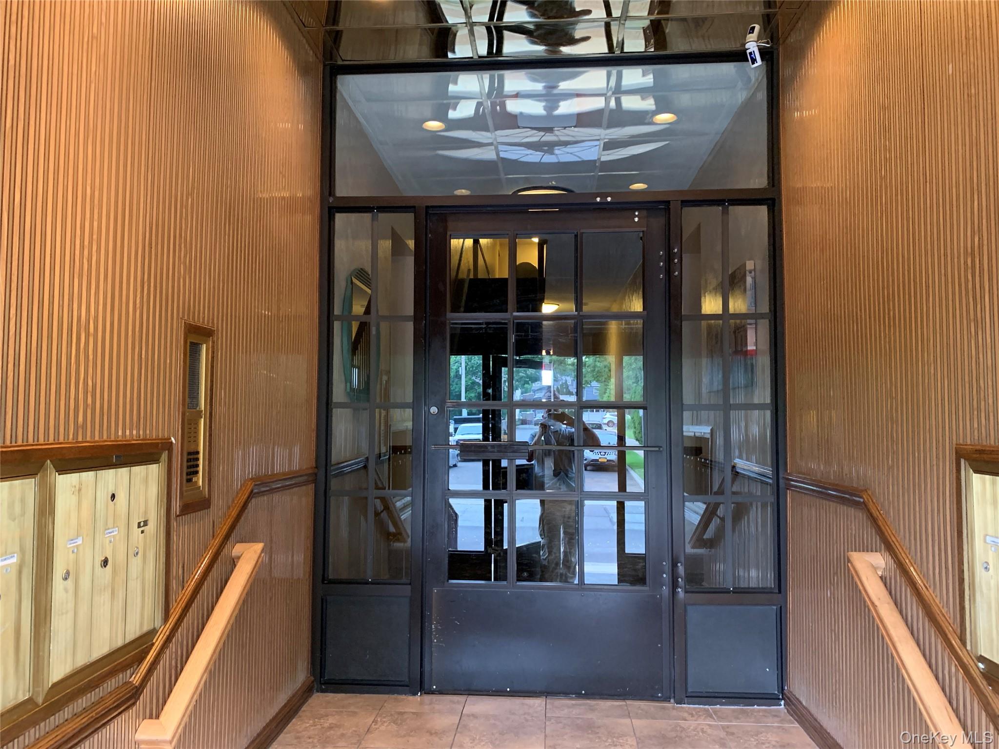 51 Smith Street, Unit B5 Merrick, NY 11566 - Photo 2 of 8 a view of a living room with a large window