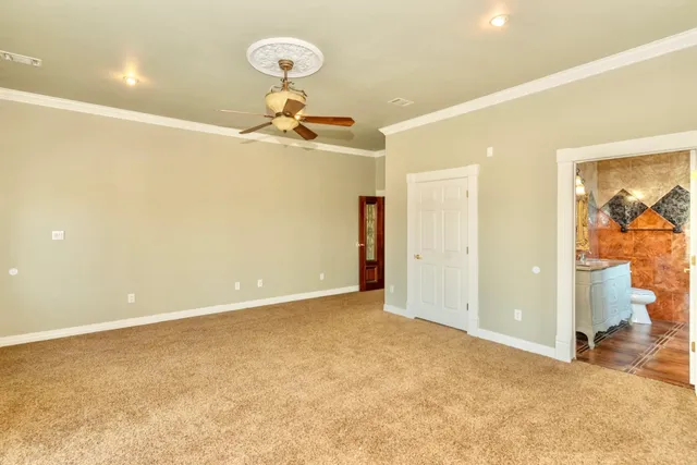 a view of an empty room with a chandelier