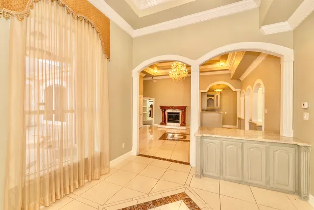 a view of a swimming pool with a ceiling fan