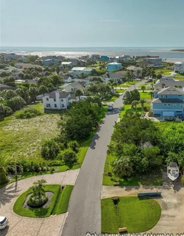 a view of a swimming pool with a yard and outdoor seating