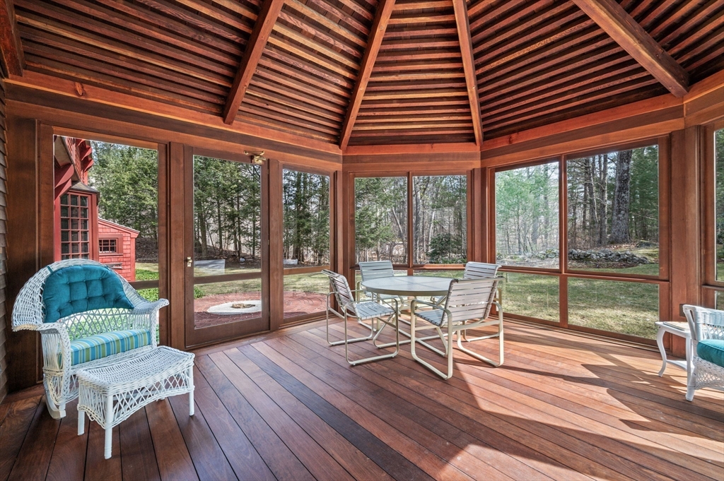 15 Woodland Road Boxford, MA 01921 - Photo 15 of 38 a dining room with wooden floor and furniture
