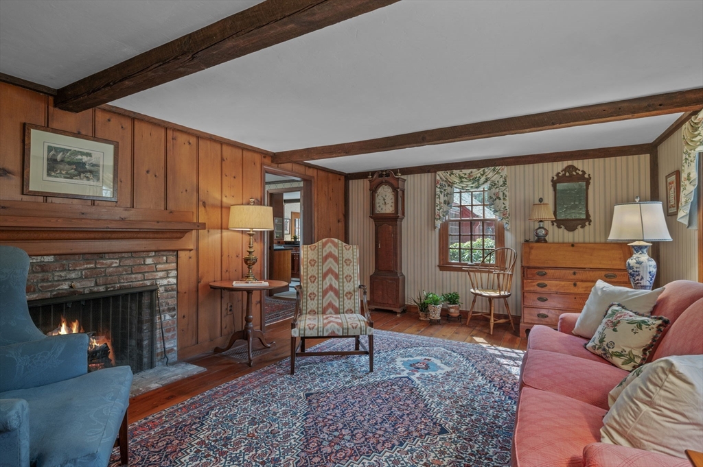 15 Woodland Road Boxford, MA 01921 - Photo 2 of 38 a living room with furniture a rug and a fireplace