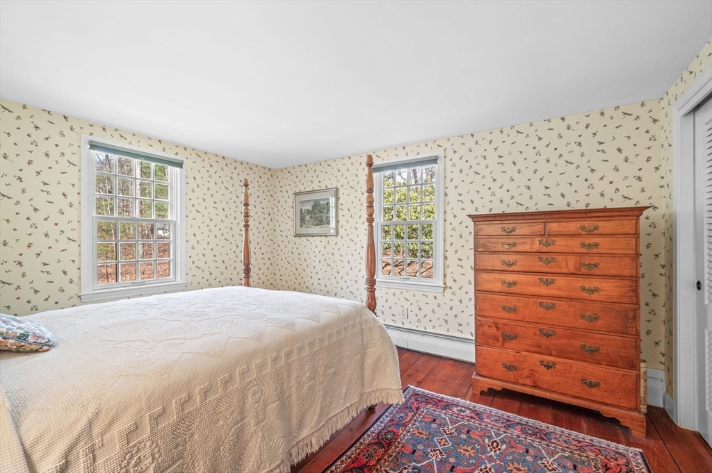15 Woodland Road Boxford, MA 01921 - Photo 21 of 38 a bedroom with a bed and a dresser