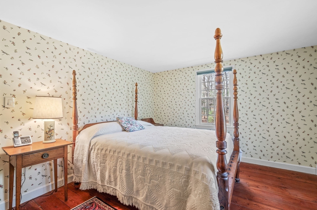15 Woodland Road Boxford, MA 01921 - Photo 22 of 38 a bedroom with a bed and wooden floor