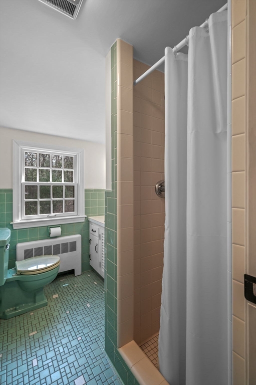 15 Woodland Road Boxford, MA 01921 - Photo 27 of 38 a bathroom with a toilet a sink and a window