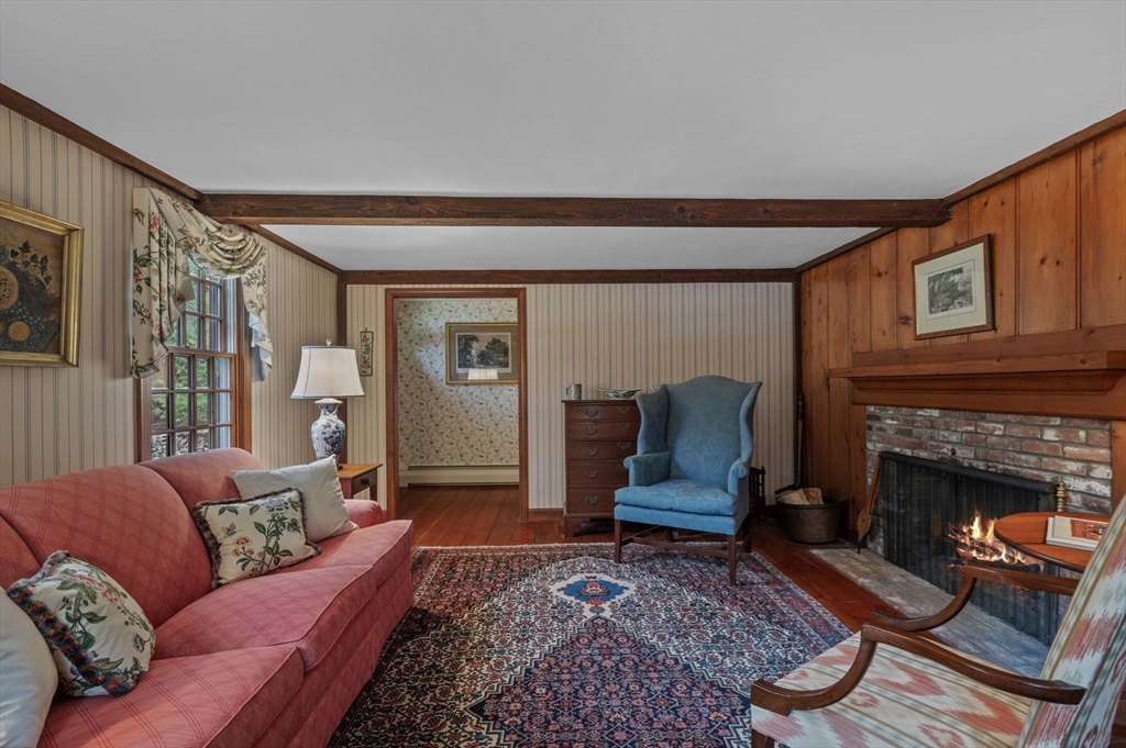 15 Woodland Road Boxford, MA 01921 - Photo 3 of 38 a living room with furniture and a fireplace